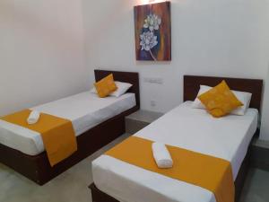 Postel nebo postele na pokoji v ubytování Everdew Kandy Rooms