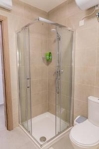 a shower stall in a bathroom with a toilet at Fancy Modern APT Sliema - w/ 2BR in Sliema