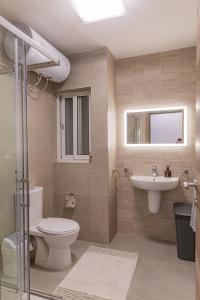 a bathroom with a toilet and a sink at Fancy Modern APT Sliema - w/ 2BR in Sliema