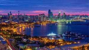 a city skyline at night with a large body of water at AEF Hotel and Restaurants in Baku