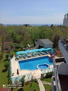 an aerial view of a swimming pool in a yard at Apartments Devora 1 & bar & restaurant in Varna City