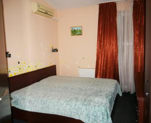 Postel nebo postele na pokoji v ubytování Kizhi ART Hotel Kharkiv