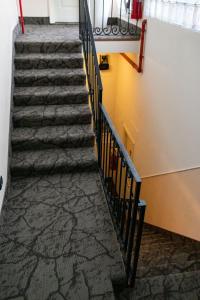 a set of stairs in a building with marble floors at Rex Hotel Residence in Genoa