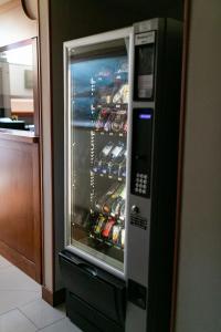 a refrigerator full of drinks in a kitchen at Rex Hotel Residence in Genoa