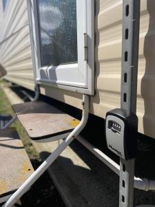 a white house with a window on a trailer at The Willerby Vacation in Leysdown-on-Sea