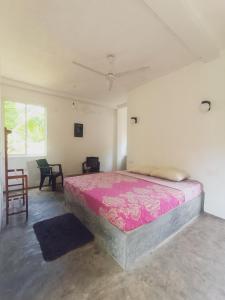Ένα ή περισσότερα κρεβάτια σε δωμάτιο στο Acmi Villa