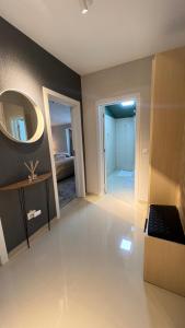 a large room with a mirror and a bedroom at Complex Rediu 54 Luxury Apartaments in Iaşi