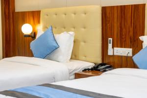Кровать или кровати в номере Hotel Dreams Connect GRB 2