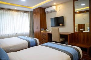 Кровать или кровати в номере Hotel Dreams Connect GRB 2