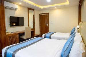 Кровать или кровати в номере Hotel Dreams Connect GRB 2