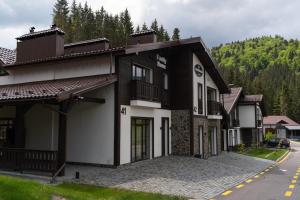 a black and white building on a street at Mal'ovanka in Bukovel
