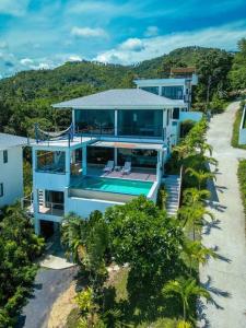 an aerial view of a house with a swimming pool at 3 Bedrooms sea view villa in Haad Yao