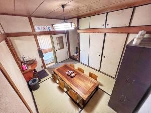 an overhead view of a dining room with a table and chairs at Bighem Maison in Izumi-Sano +96 photos