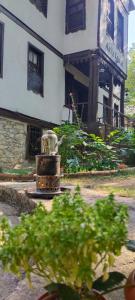 a building with a fountain in front of a building at Asya konak in Safranbolu