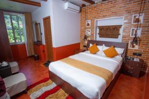 Postel nebo postele na pokoji v ubytování Chautari Boutique Hotel
