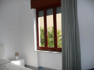 Postel nebo postele na pokoji v ubytování Garden House Ercolano