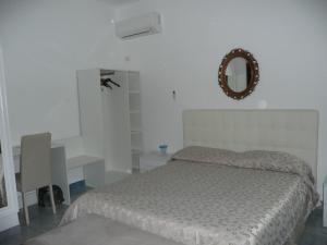 Postel nebo postele na pokoji v ubytování Garden House Ercolano
