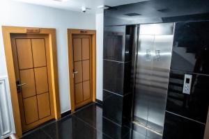 a row of three elevators in a room at Chautari Boutique Hotel in Pokhara
