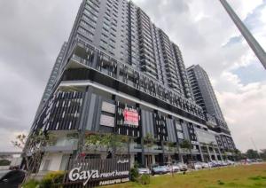 a tall building with cars parked in front of it at Comfy 2R2B Modern High-Floor Retreat #GA4 in Shah Alam