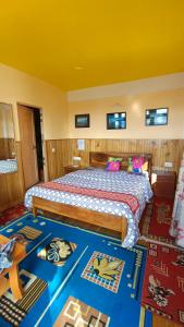 a bedroom with a large bed in a room at Rambler's Nesting Homestay in Darjeeling