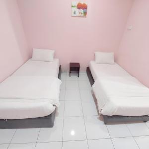 Postel nebo postele na pokoji v ubytování Hotel Lean Fatt