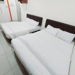 Postel nebo postele na pokoji v ubytování Hotel Lean Fatt