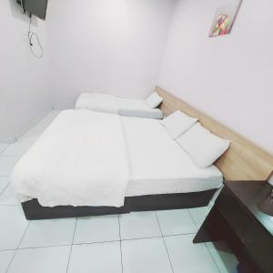 Postel nebo postele na pokoji v ubytování Hotel Lean Fatt
