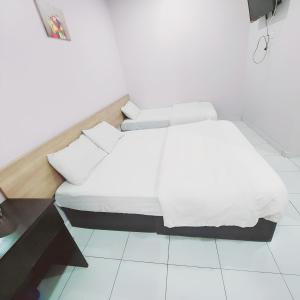 Postel nebo postele na pokoji v ubytování Hotel Lean Fatt