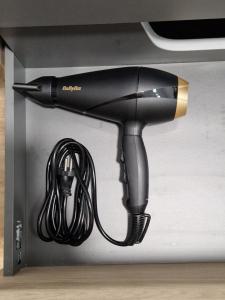 a black hair dryer sitting in a box at Gwenaelle et Cyrille in Abbeville