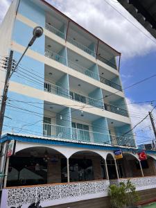 a tall building with balconies on top of it at Kiwi Boutique Hotel in Patong Beach