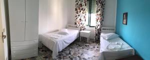 Postel nebo postele na pokoji v ubytování B&B L'Oasi