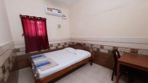 Posteľ alebo postele v izbe v ubytovaní Sai Homes Chidambaram