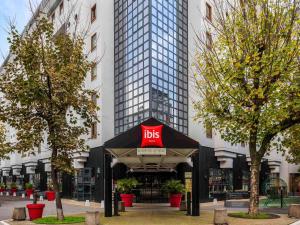 a hotel with a ups sign in front of a building at ibis Paris Bastille Opera in Paris