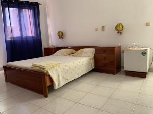 Uma cama ou camas num quarto em Residencial Pôr do Sol