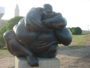 a statue of a man sitting on top at Piso con Encanto en Coruña. in A Coruña