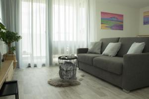a living room with a couch and a table at Apartmán X28 in Mikulov