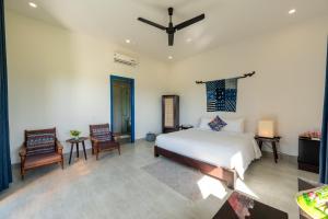 Postel nebo postele na pokoji v ubytování Chez Mimosa Hoi An - LUA Retreat