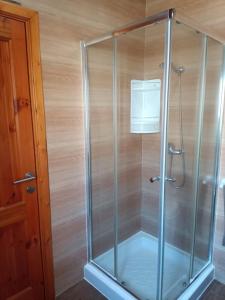 a shower with a glass enclosure in a bathroom at Serene apartment in Haz-Zebbug in Taʼ Srina