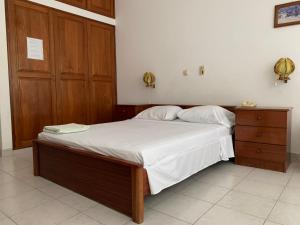 Uma cama ou camas num quarto em Residencial Pôr do Sol