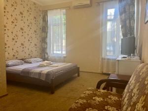 Posteľ alebo postele v izbe v ubytovaní Apartments on Chaykovskogo 16