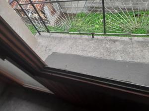 a view from a window of a balcony with grass at Hanka Delic Lepinac in Gračanica