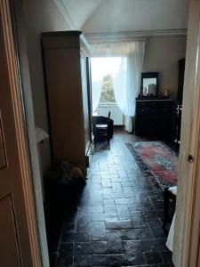 a hallway of a house with a room with a window at Nel borgo con vista castello in Poppi