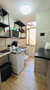 a kitchen with a sink and a counter top at Soha's Holiday in Rome