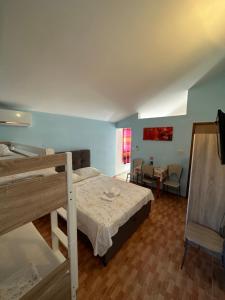 Postel nebo postele na pokoji v ubytování Apartments Palinić