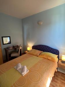 Postel nebo postele na pokoji v ubytování Apartments Palinić