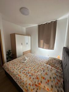 Postel nebo postele na pokoji v ubytování Apartments Palinić