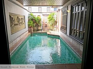 a swimming pool in the middle of a building at ALPINE GLX PD Port Dickson in Port Dickson