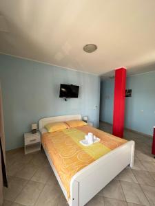 Postel nebo postele na pokoji v ubytování Apartments Palinić