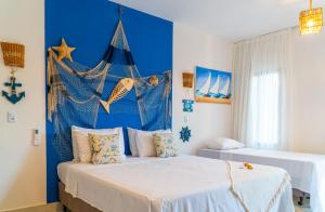 Postel nebo postele na pokoji v ubytování Pousada Solarium de Gostoso + 37 fotografií