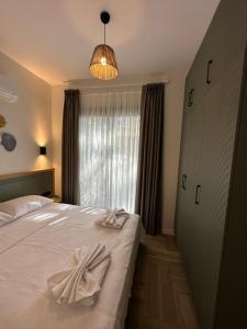 Кровать или кровати в номере Esmahan Forest and Pool by Zehra Suites